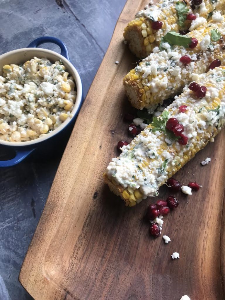 close up Mexican Street Corn side dish on carving board delicious for any meal