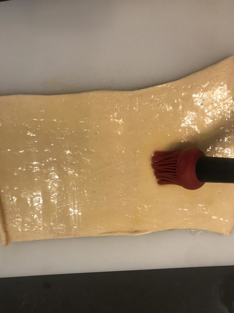 brush dough with butter