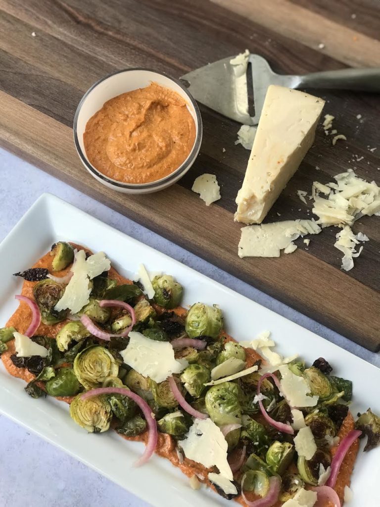 cheese platter with romesco and brussels sprouts