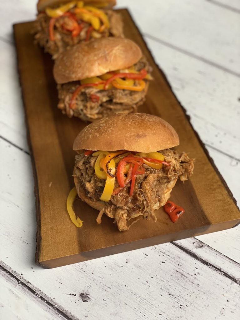 3 pulled pork sandwiches in a line 